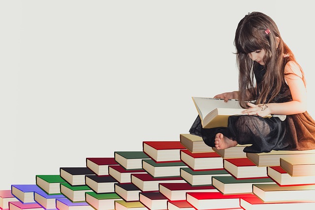 Gifted intelligent girl reading a stack of books