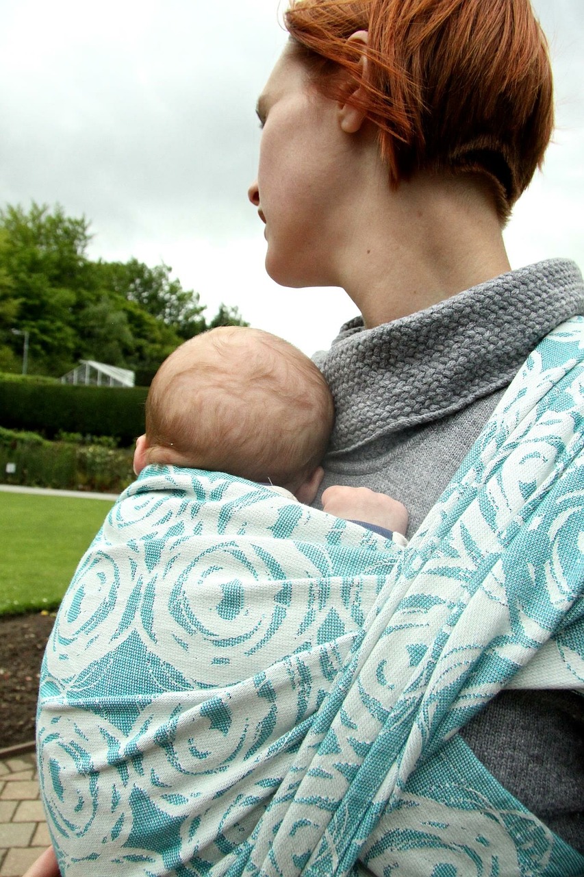 Mother carrying a baby