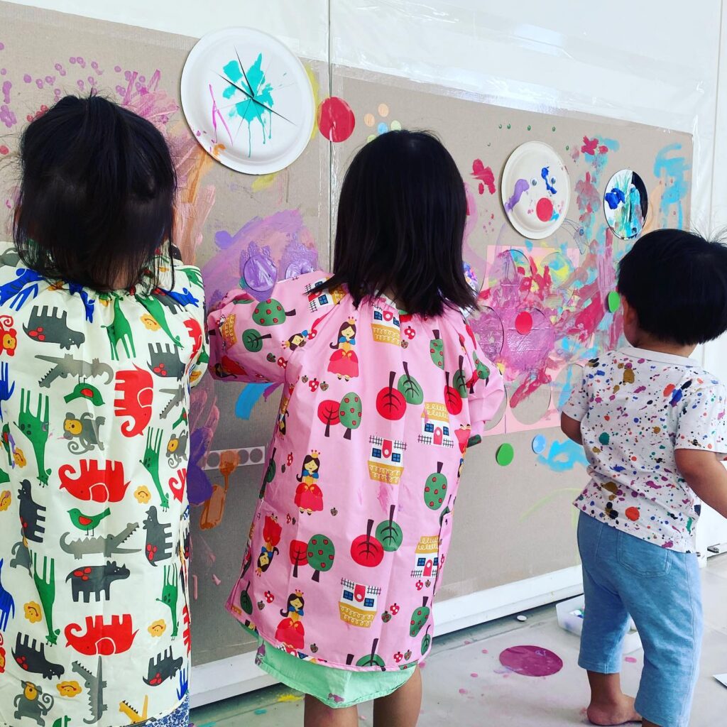 Kids painting on the wall