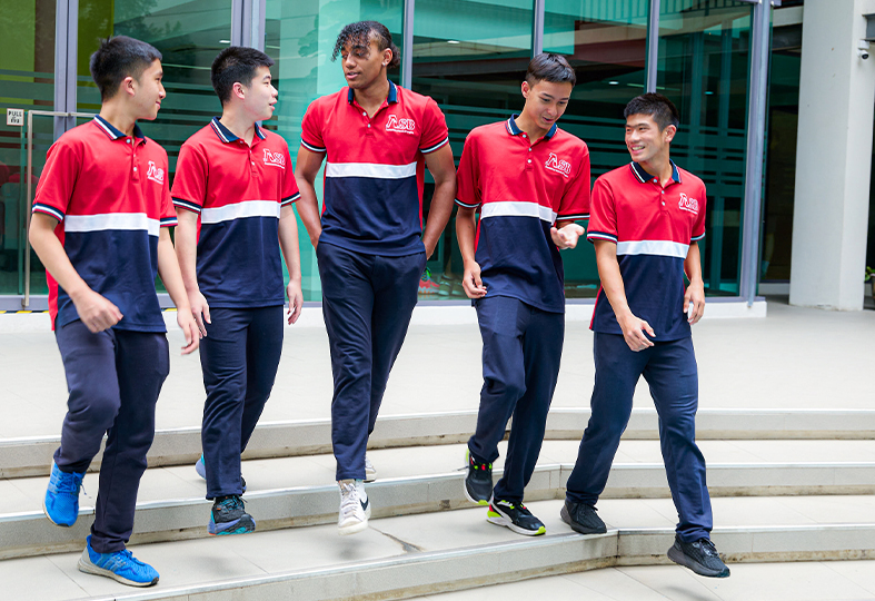 Group boys at secondary walk at school XCL American school of Bangkok