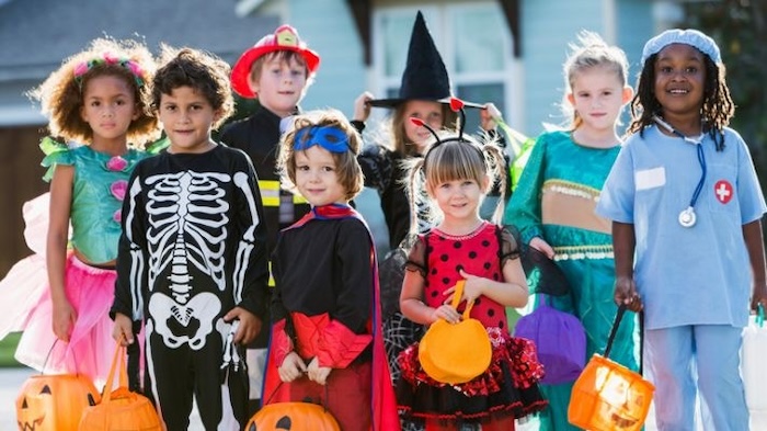 Group kids wearing Halloween costumes