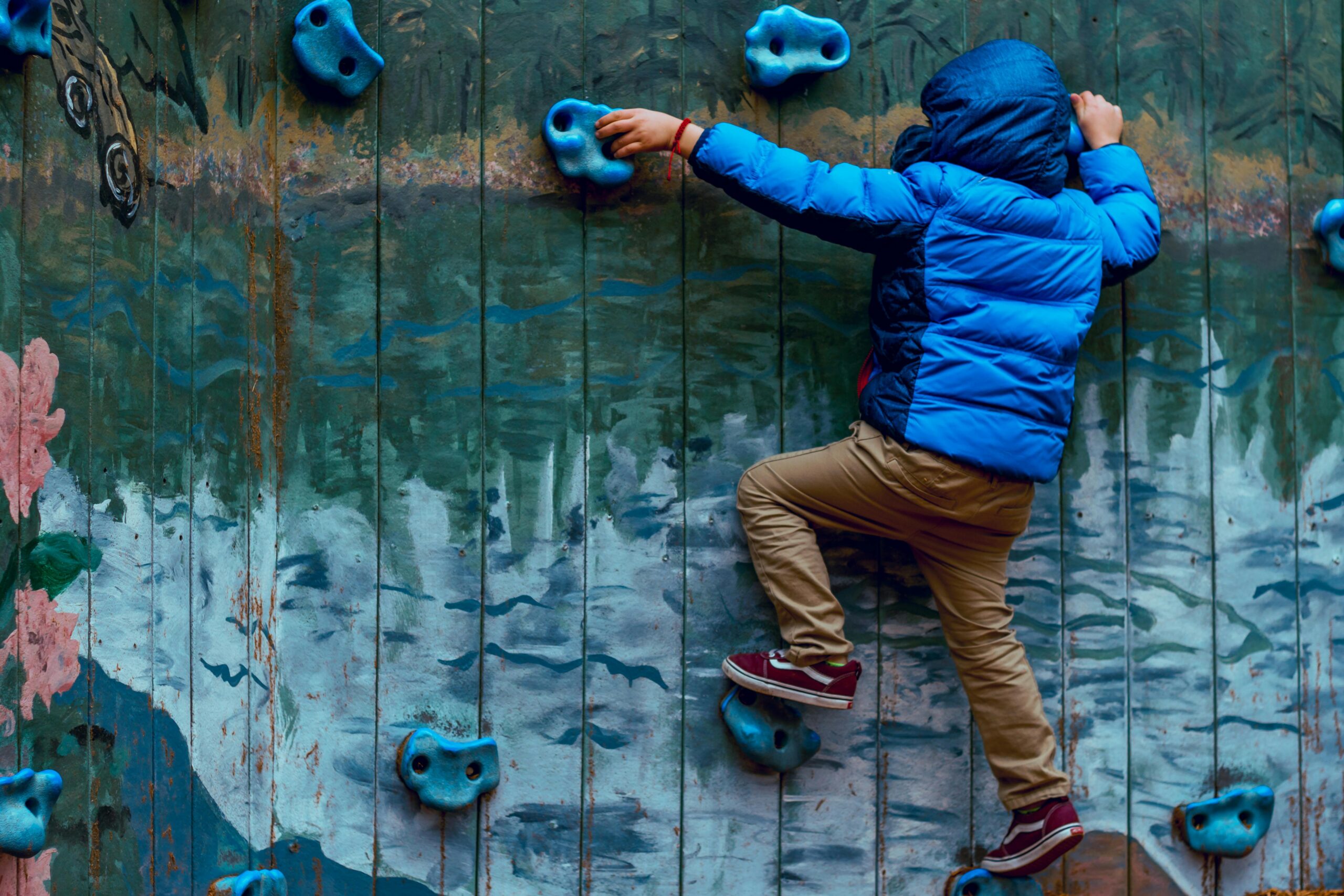 Boy on a rock climbing wall