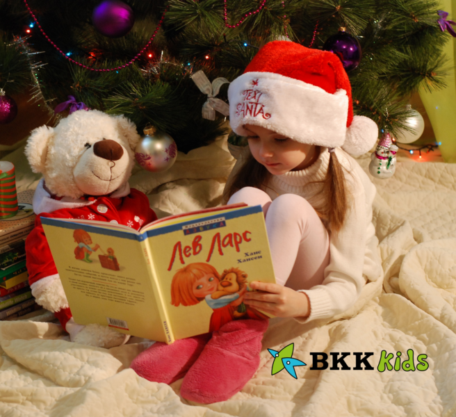 Girl reading a book on christmas seasonal