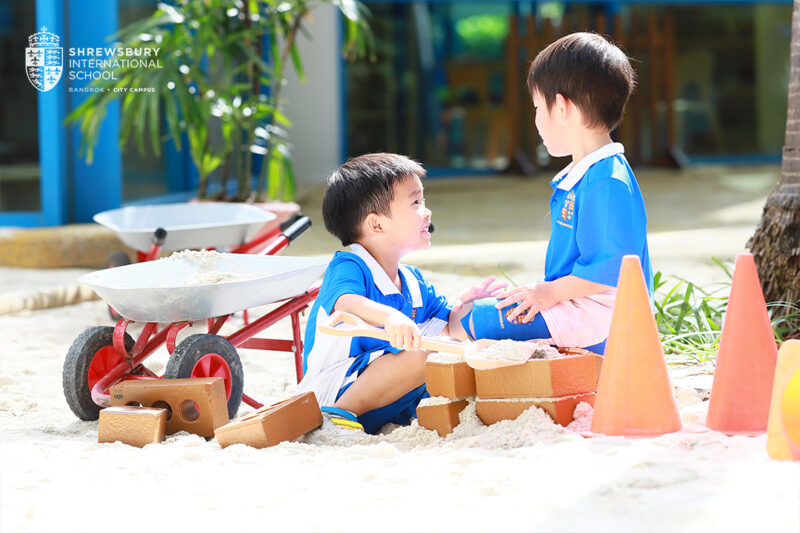 Kids playing in a school sandpit