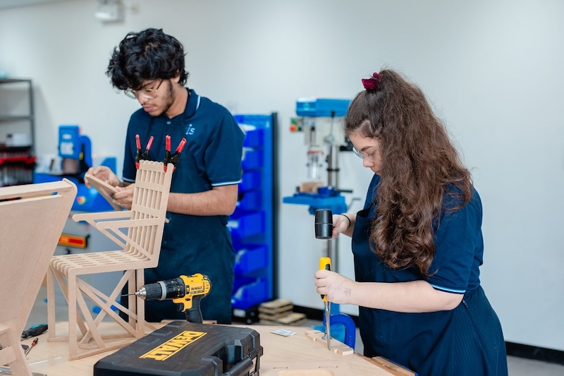 2 Students Kids work with woods in the class