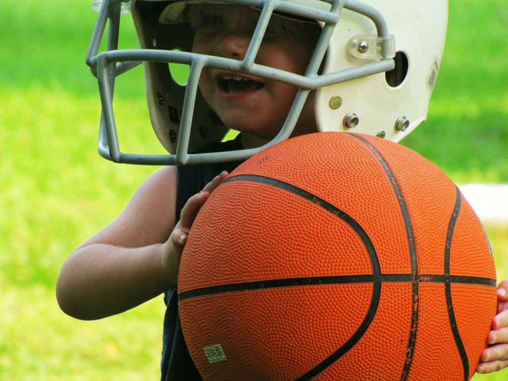 Kid is holding basketball