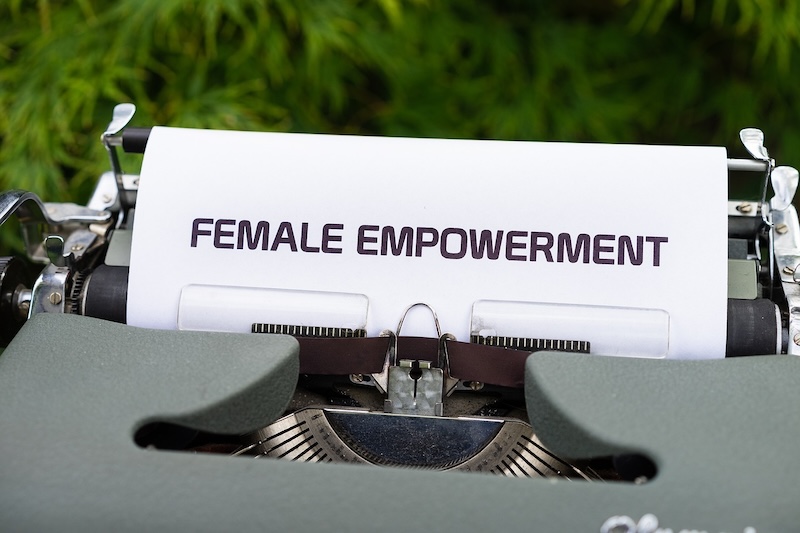 Words 'Female Empowerment' typed on paper on a typewriter
