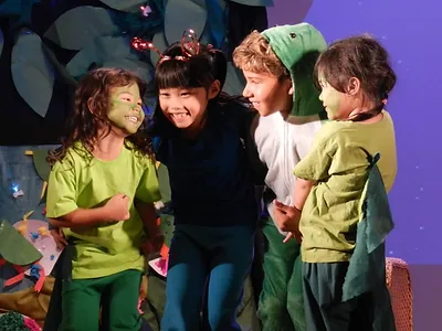 Group of kids having dun in a drama show