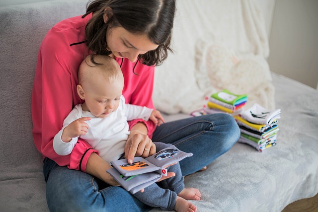 mother reading books to a baby