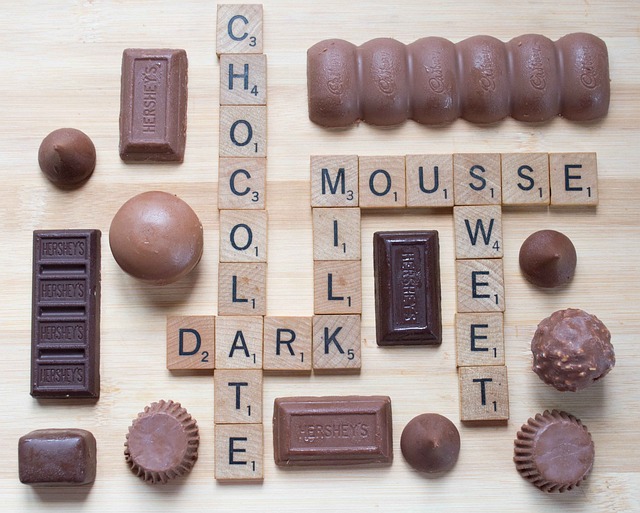 mixed varieties of dark chocolate made into a scrabble board