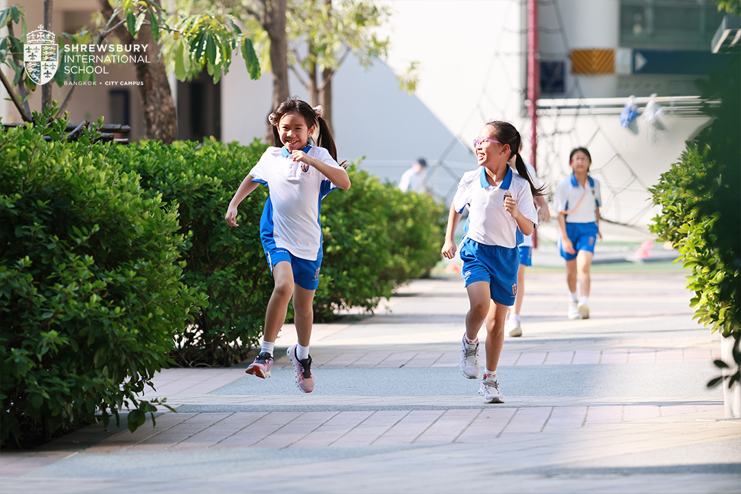 Group of kids running at school