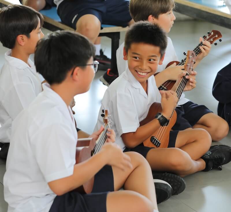 Group of boys playing guitars