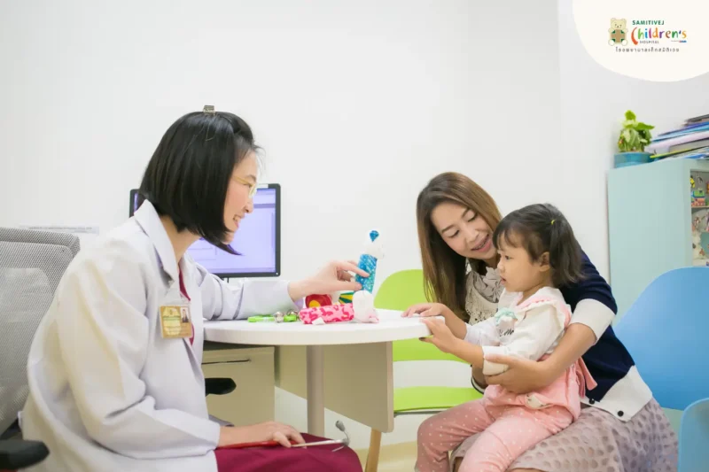 Dr talking to a mother and child