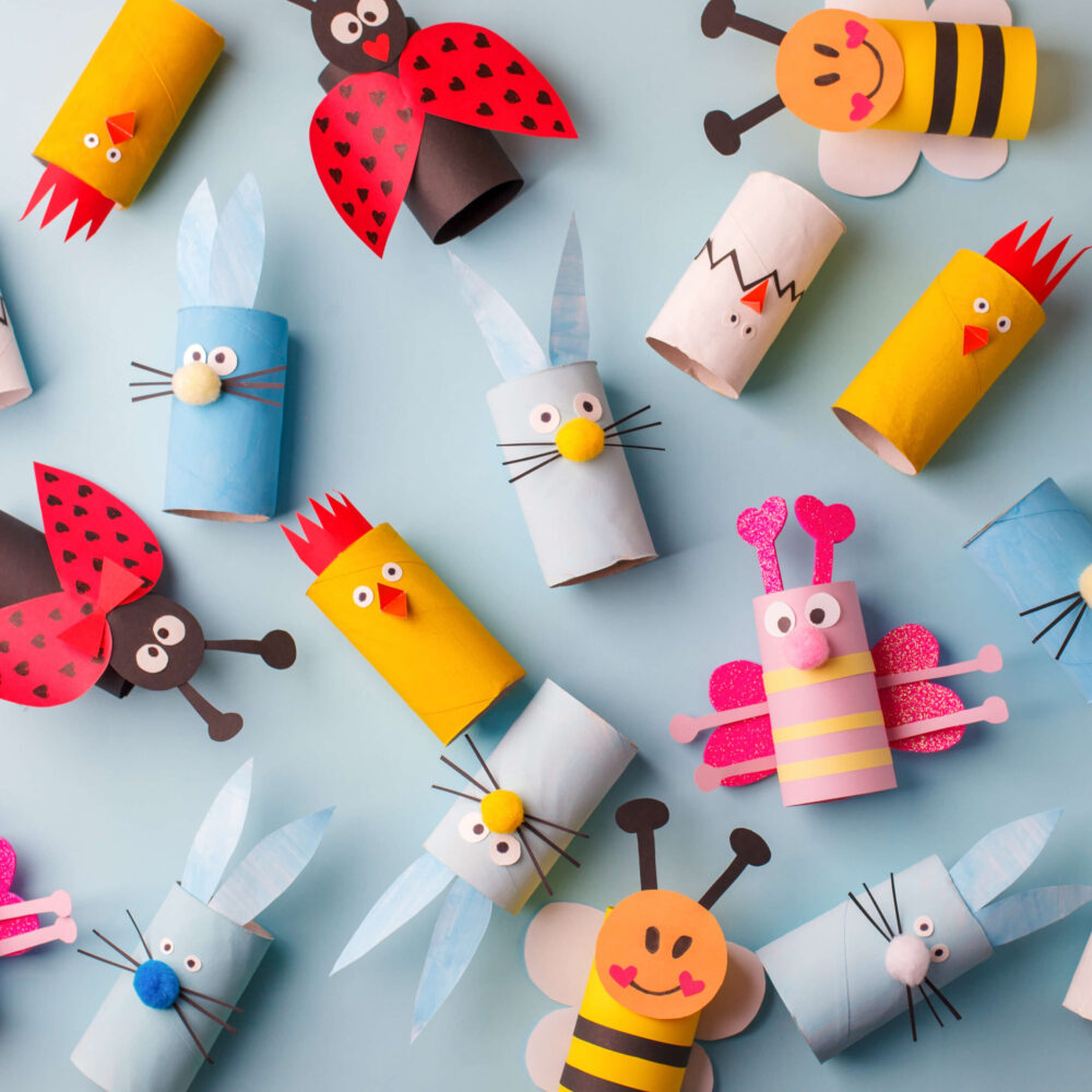 Happy easter kindergarten decoration concept - rabbit, chicken, egg, bee from toilet paper roll tube. Simple diy creative idea. Eco-friendly reuse recycle decor, daycare paper craft