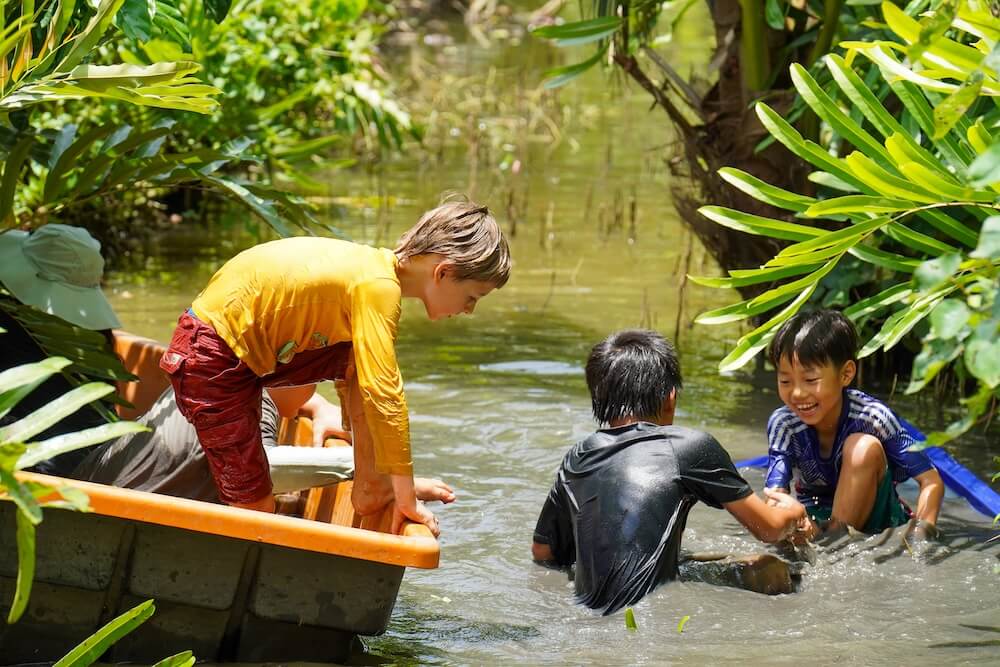 Kids play on the water