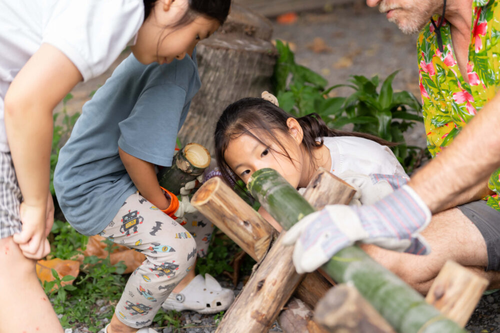 girl looking in bamboo