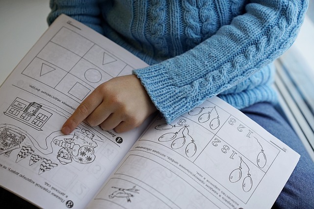 child learning to read with a picture book