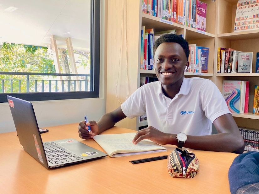 UWC - Diploma Programme (DP) - Student at a desk with a laptop